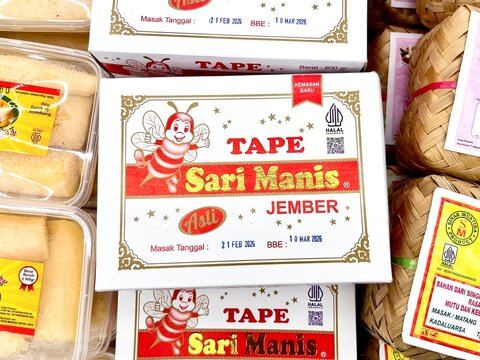 Jakarta, Indonesia - February 25th, 2026 - Sari Manis brand tape or fermented cassava food box packaging isolated on horizontal ratio background.