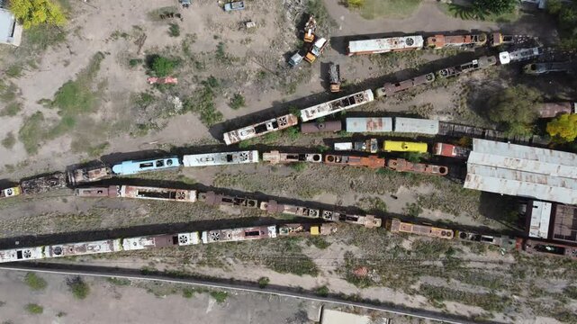 Aerial Perspective of Old Railway Station with Trains in Decay