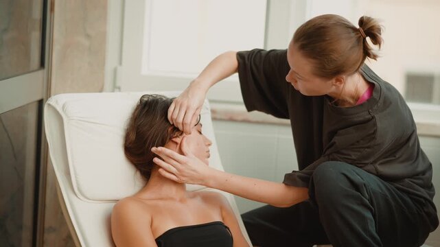 Cosmetologist precision brow shaping and facial grooming