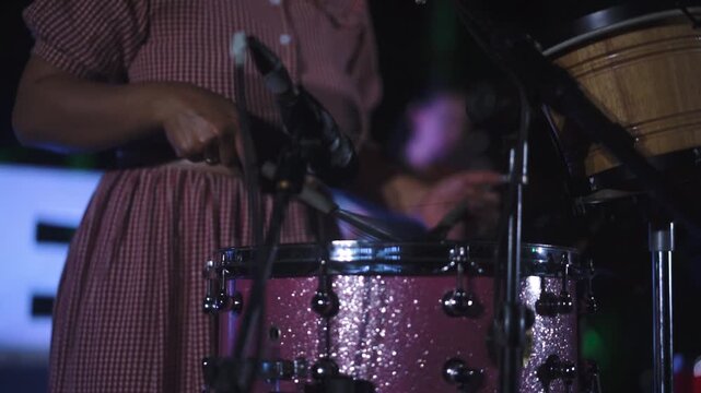 Close-up drummer playing drum in music concert or performance