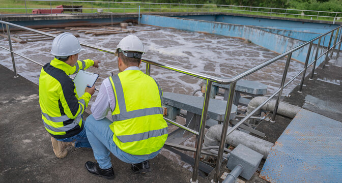 Environmental engineers work at wastewater treatment plants,Water supply engineering working at Water recycling plant for reuse