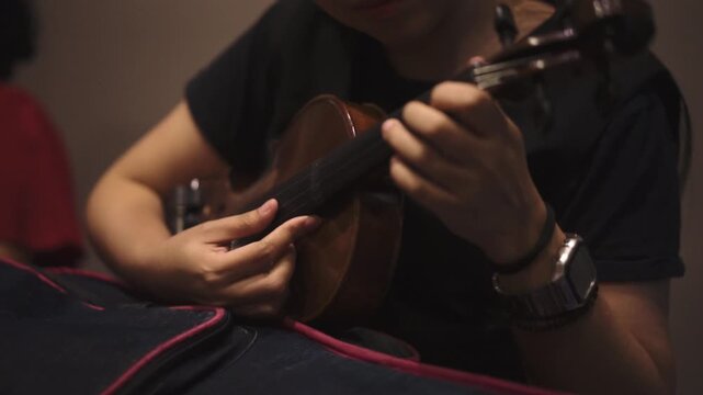 Female Violinist Playing in Dramatic Studio Lighting