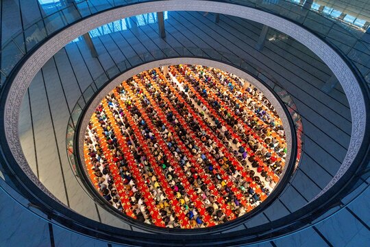 An aerial view shows thousands of worshippers taking part in a mass iftar at Masjid Al Mustafa beside Madani Avenue in the Bhatara area of Dhaka