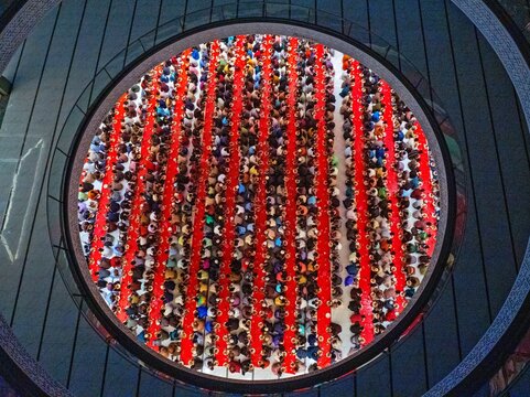 An aerial view shows thousands of worshippers taking part in a mass iftar at Masjid Al Mustafa beside Madani Avenue in the Bhatara area of Dhaka
