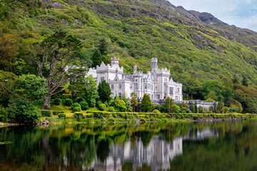 Kylemore Abbey with water reflections in Connemara, County Galway, Ireland, Europe. Benedictine monastery founded 1920 on the grounds of Kylemore Castle. Mainistir na Coille Moire