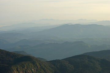 Fototapeta premium Panoramic View of Misty Mountain Ranges from Adam's Peak Sri Lanka