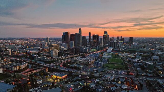 Sunset city view of LA. Downtown Los Angeles from drone. Los Angeles skyline at dusk. Evening in Los Angeles city, LA architecture. Los Angeles downtown aerial panorama. City of LA in sunset.