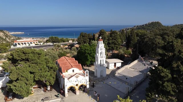 Aerial flight over rodos greek church by the sea