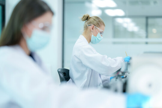 Pharmaceutical quality control analyst validating equipment sterility protocols. R&D chemist monitoring autoclave sterilization cycle for biopharmaceutical compliance.