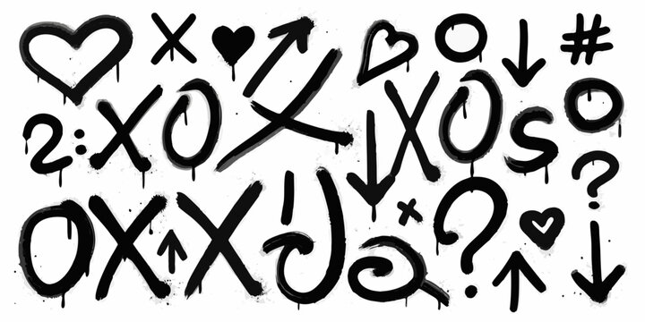Black spray paint graffiti with hearts arrows and various symbols