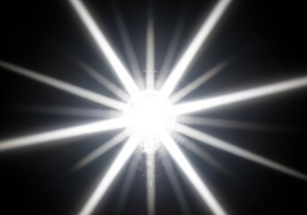 Obraz premium A bright white light with rays on a black background