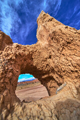 Cathedral Gorge Arch Formation with Dramatic Sky and Desert Landscape Perspective