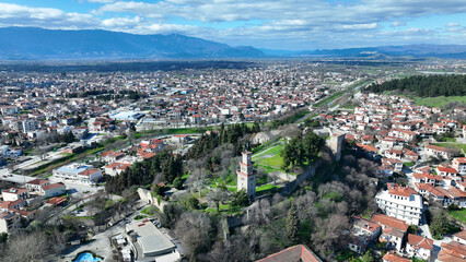 Fototapeta premium Aerial drone photo of iconic Byzantine castle of Trikala ancient citadel built northeastern side of the city in a small hill featuring clock tower with great views in old city of Trikala, Thessaly, Gr