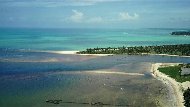 Meeting of the river waters with the sea in Alagoas beach. Alagoas skyline.