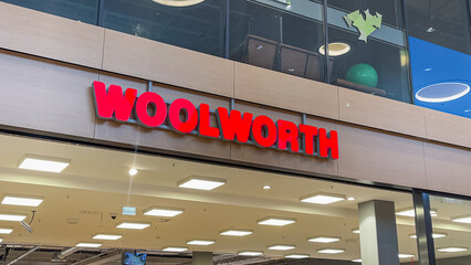 Naklejka premium February 15, 2026, Lubeck, Germany: Woolworth storefront sign above interior retail area
