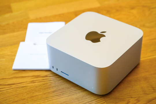 Novi Sad, Serbia - February 25, 2026: Unboxed Apple Mac Studio in silver finish, centered on a light wooden table.
