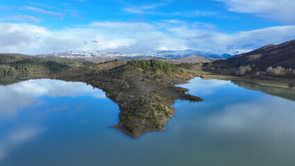 Fototapeta premium Aerial drone photo of beautiful winter colours and amazing cloud reflections in Mediterranean destination artificial lake