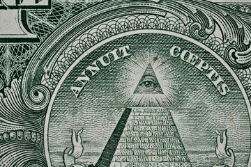Macro View of the All-Seeing Eye on a US One Dollar Bill Pyramid