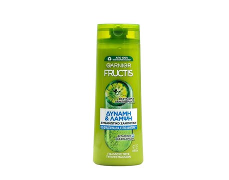 Photo of a bottle of Garnier Fructis strength and shine shampoo with grapefruit extract and vitamin B3 (Niacinamide). Garnier Fructis is a hair-care product line f