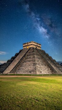 Chichen Itza Pyramid at Dusk with Milky Way Galaxy Overhead.