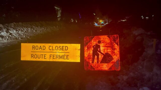 Night Road Closed Sign and Construction Worker Symbol in Quebec Canada