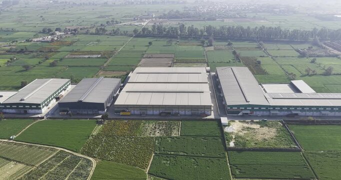 Drone view of warehouse located in middle of the farm 4k footage