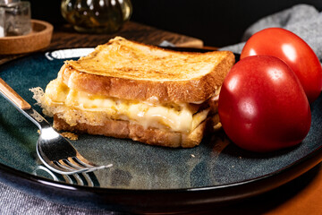 Grilled cheese, eggs and ham sandwich.