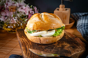 Sandwich with lettuce and boiled egg.