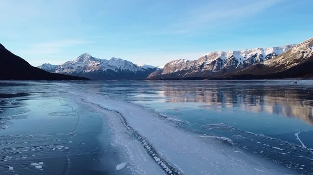 Aerial Abraham Lake Frozen Methane Bubbles and Rocky Mountains Fly Through