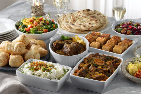 beautifully arranged eid alfitr feast filled with assortment of traditional dishes