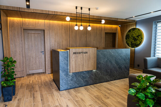 Modern hotel reception desk interior with stylish lobby design and warm lighting