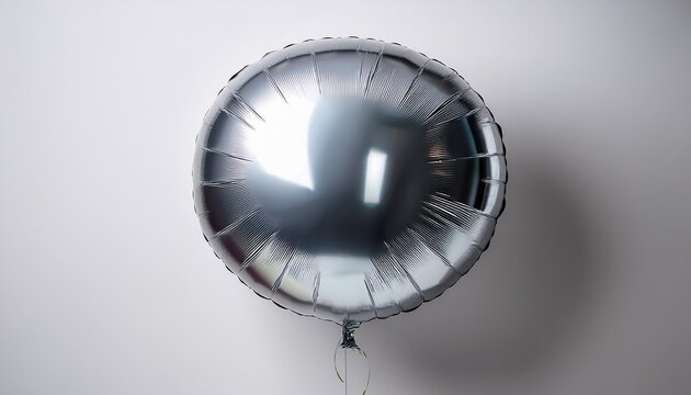 A Shiny Silver Foil Balloon With A Round Shape Floats Against A Clean White Backdrop Its Metallic Surface Reflecting Light Creating A Festive Impression Indeed