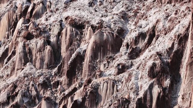 Colorful salt mountains on Hormuz Island in Iran, known as the Rainbow Island, featuring surreal mineral Martian landscape and vivid natural patterns in Persian Gulf. Unique geological formations 
