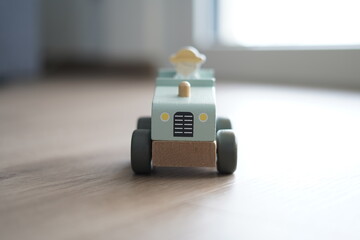 Children's wooden toy. We see the front of the tractor.