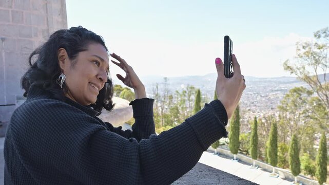 Smiling Woman Capturing Selfie Content with Urban Panorama in Pachuca