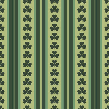 St. Patrick's Day seamless green shamrock pattern with vertical stripes. Lucky clover background for Irish holiday celebrations, festive wallpaper, scrapbooking, and March 17th event designs.
