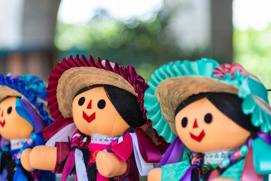 Colorful Handcrafted Mexican Maria Doll Souvenirs for sale at outdoor market