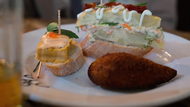 Closeup of the plate of pinchos, a famous tapas dish from Spain's Basque Country 　