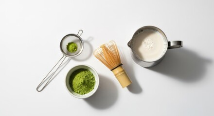 powdered green tea preparation ingredients arranged on a white surface