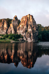 The Externsteine Rock Formation at Sunrise, Ancient Sandstone Pillars Glowing in Golden Morning Light