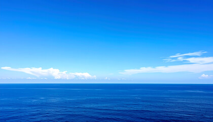 Obraz premium A vast expanse of clear blue sky stretches across the frame, transitioning smoothly 
