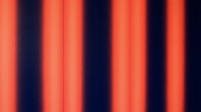 Vibrant orange and black vertical striped pattern background texture
