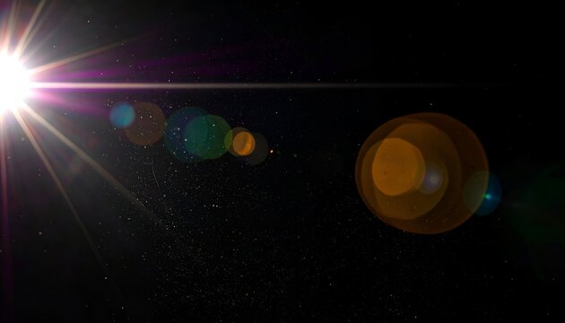 Bright sun flare with colorful lens flares against a dark backdrop