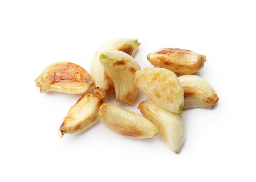 Fresh grilled garlic cloves isolated on white