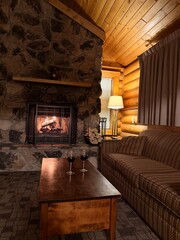 Naklejka premium Fireplace and furniture in cozy room. Interior design