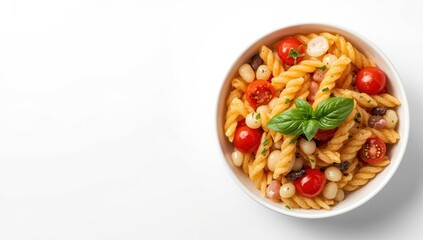 Delicious pasta salad with tomatoes and basil in a bowl on a white backdrop