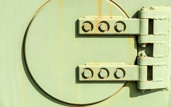 Canada, Alberta, Calgary.  detail of steel hatch on the side of a military tank.  Calgary Military Museum