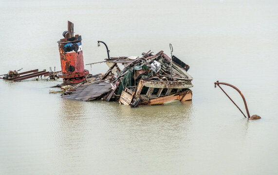 USA, Oregon, Gold Beach.  Abandoned sunken boat.