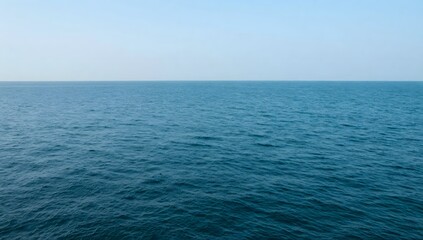 Fototapeta premium Calm turquoise ocean view beneath a clear sky for scenic and peaceful backgrounds