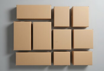 Obraz premium Arrangement of cardboard boxes on a grey surface viewed from directly above